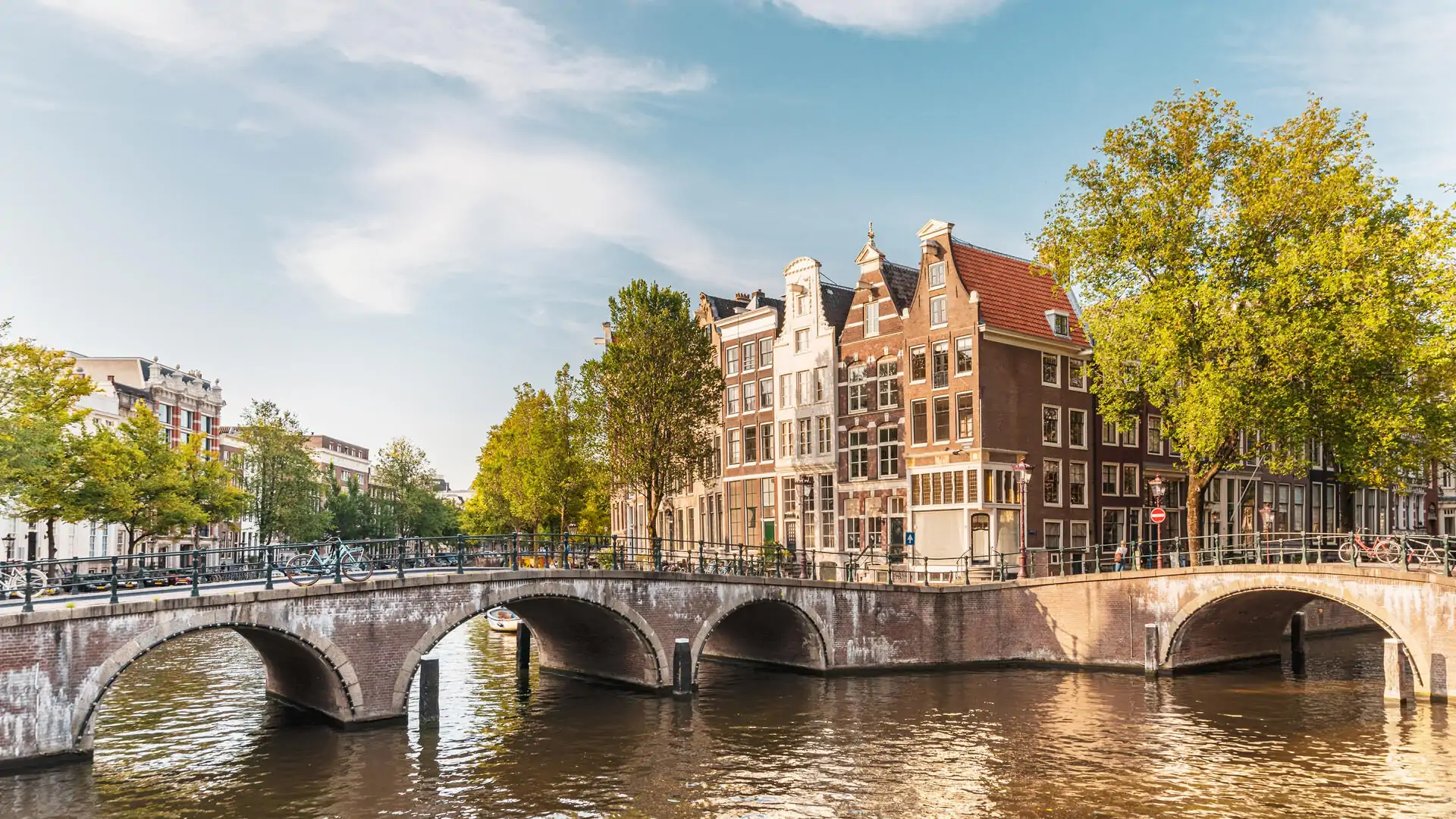 9-dest_netherlands_amsterdam_bridge_canal_gettyimages-1172736144_universal_within-usage-period_79471