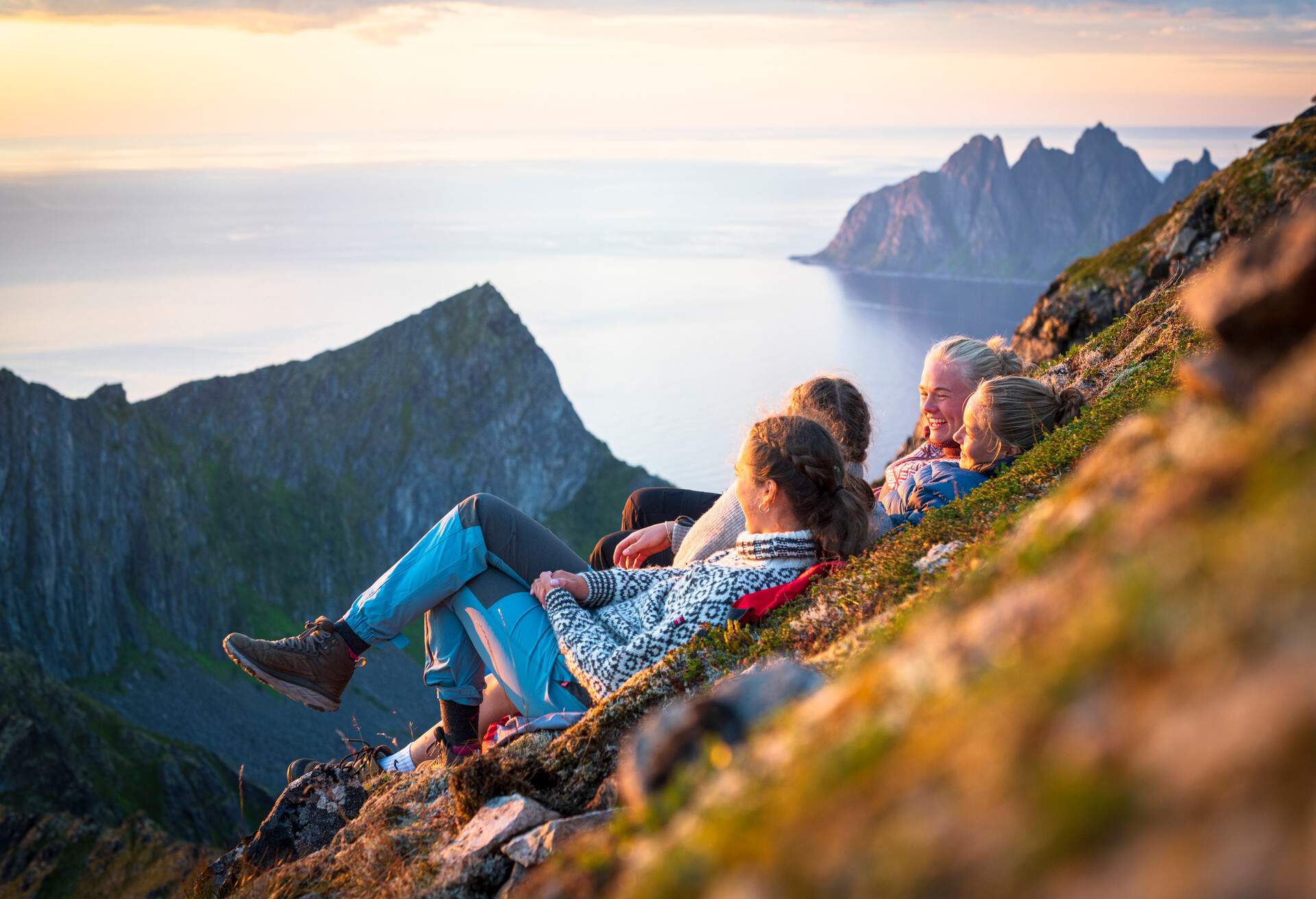 DEST_NORWAY_SENJA_ISLAND_FJORD_GIRLS_GettyImages-1356638606