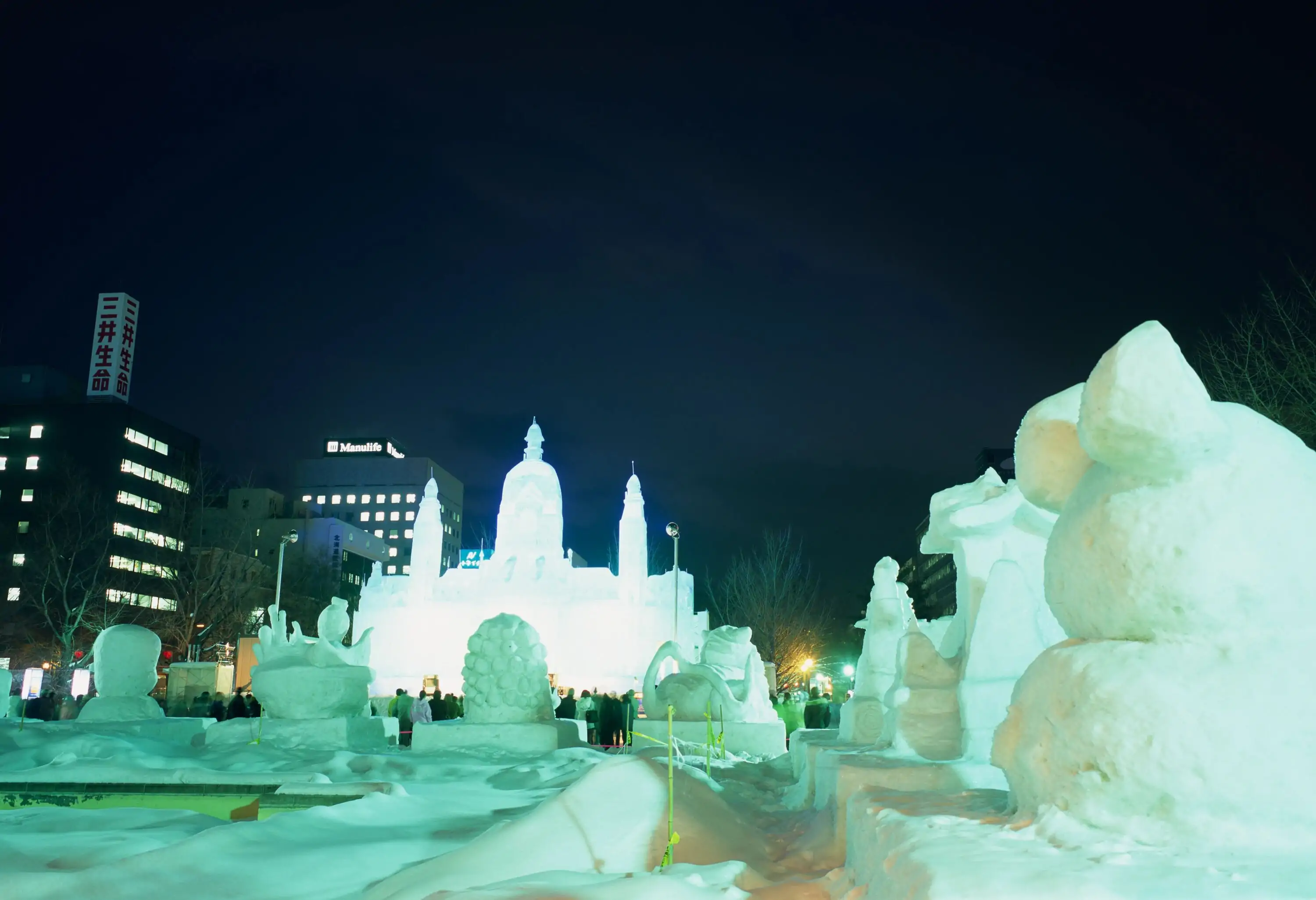 A mesmerising collection of ice sculptures illuminated at night on display for the snow festival.