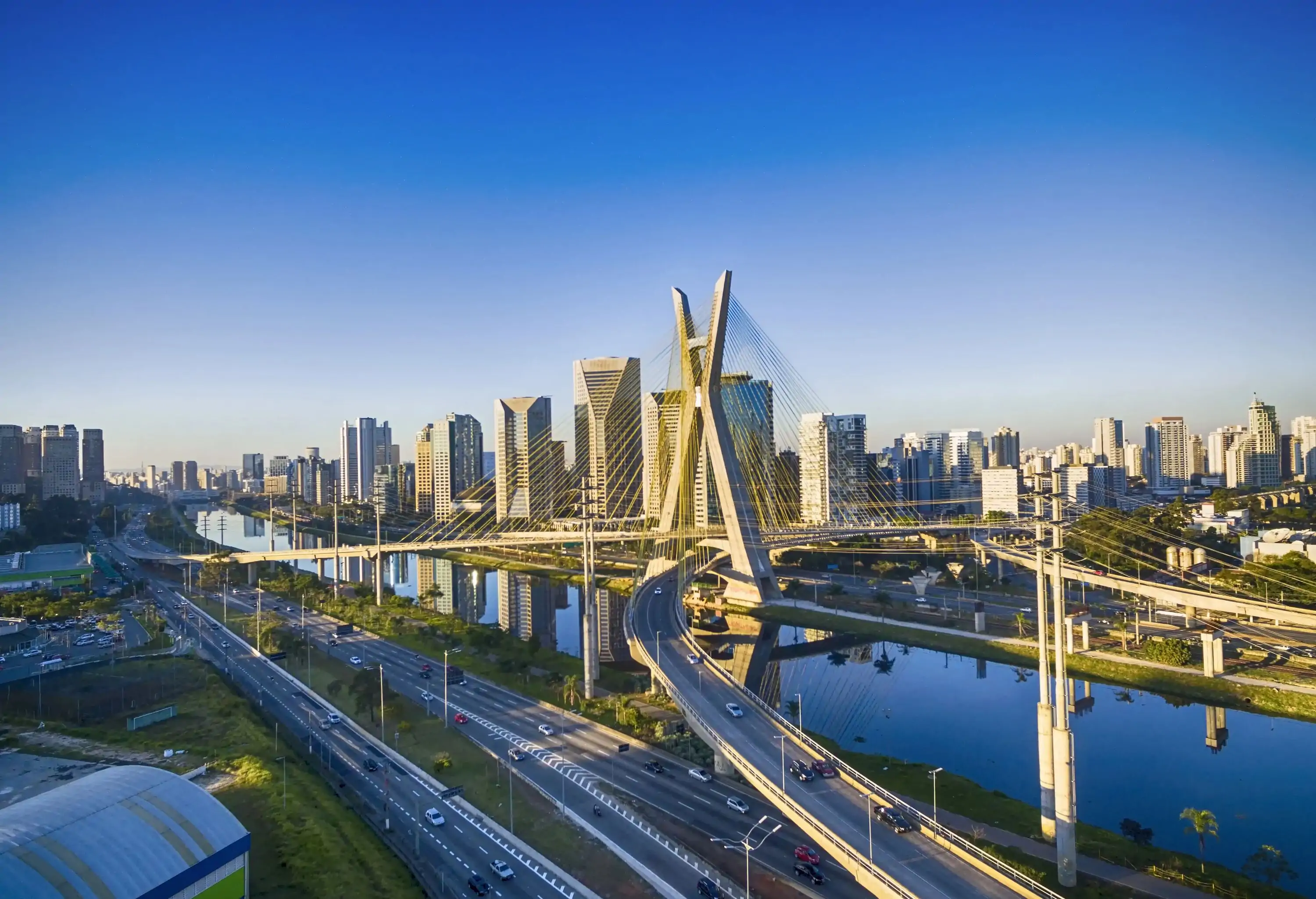 The Octávio Frias de Oliveira Bridge running over major highways that crisscross the banks and the river.