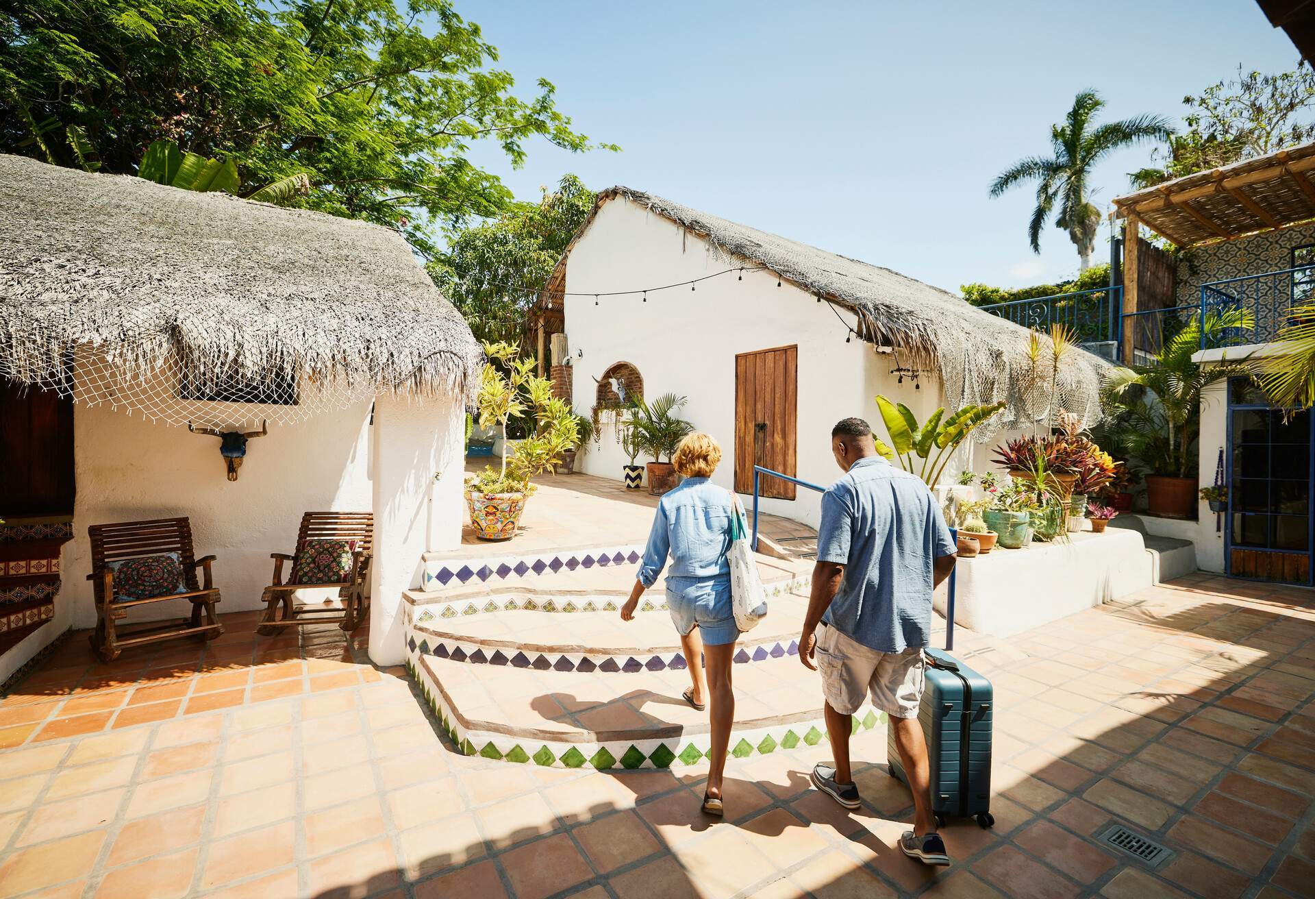 dest_mexico_theme_hotel_guesthouse_stays_people_couple_suitcase_gettyimages-1438003600