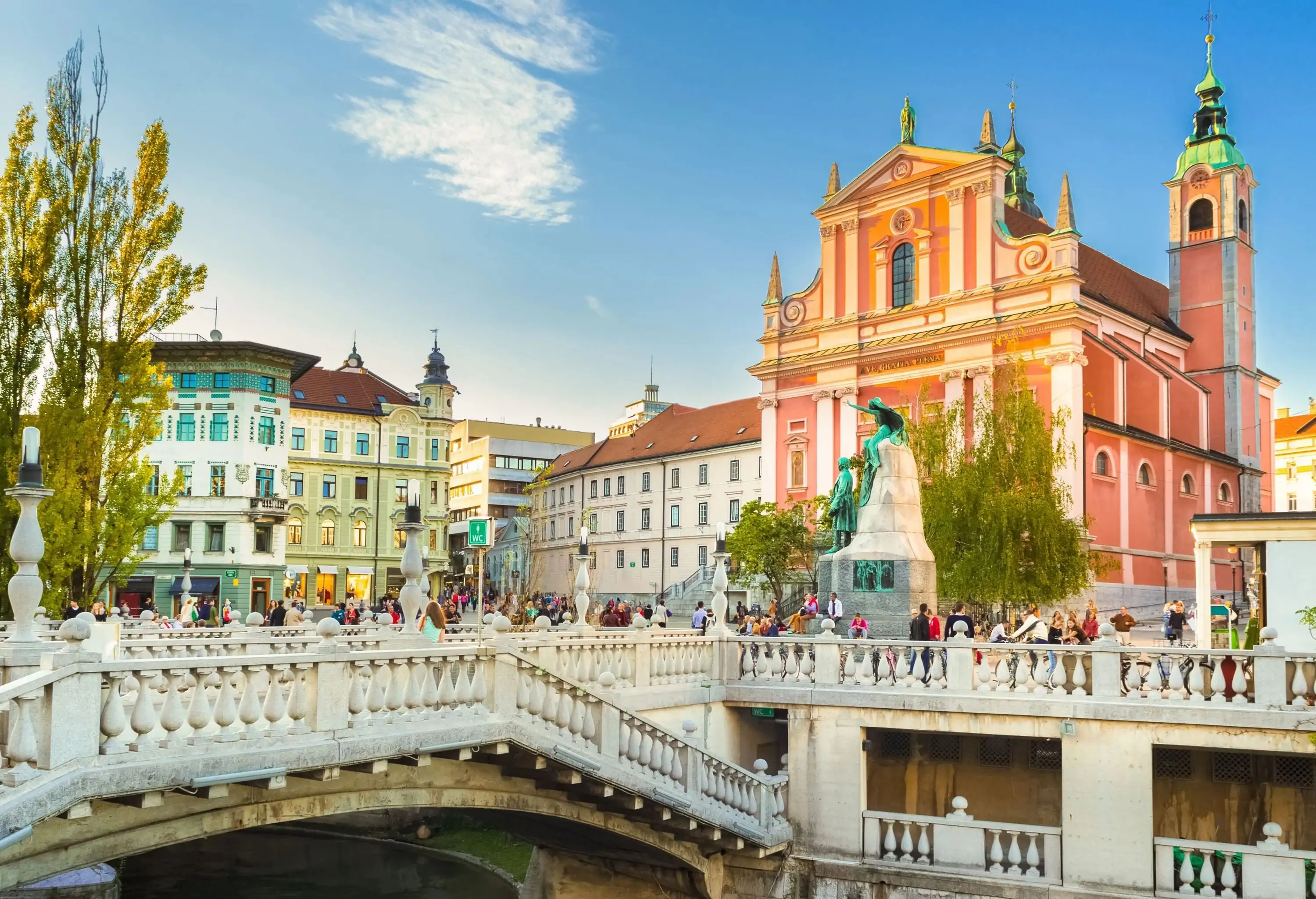 Romantic Ljubljana's city center: river Ljubljanica, Triple Bridge, Tromostovje, Preseren square and Franciscan Church of the Annunciation. Ljubljana, Slovenia, Europe.