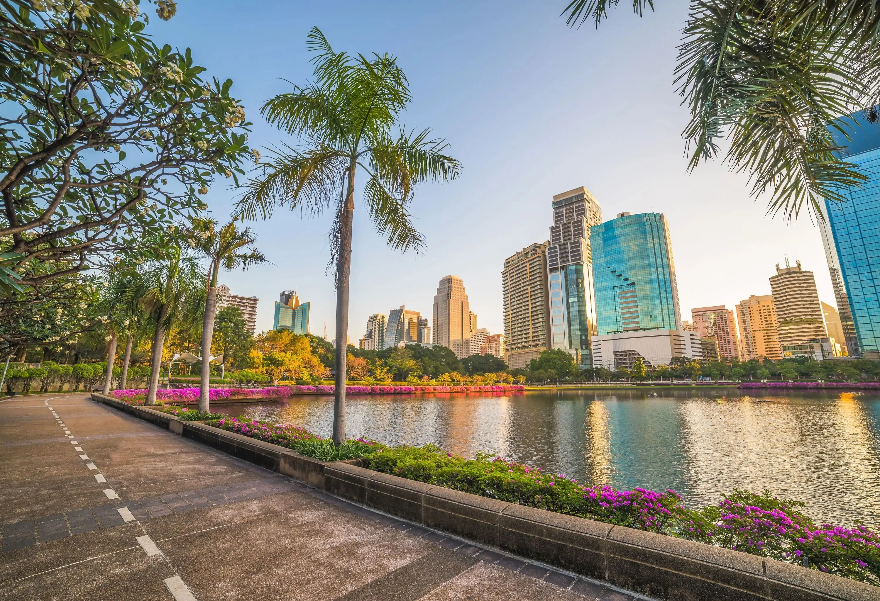 Nice Runing Track in the City Park. Wonderful View of Benjakiti Park at Sunrise. Beautiful Morning Scene of Public Park in Bangkok, Thailand, Asia.