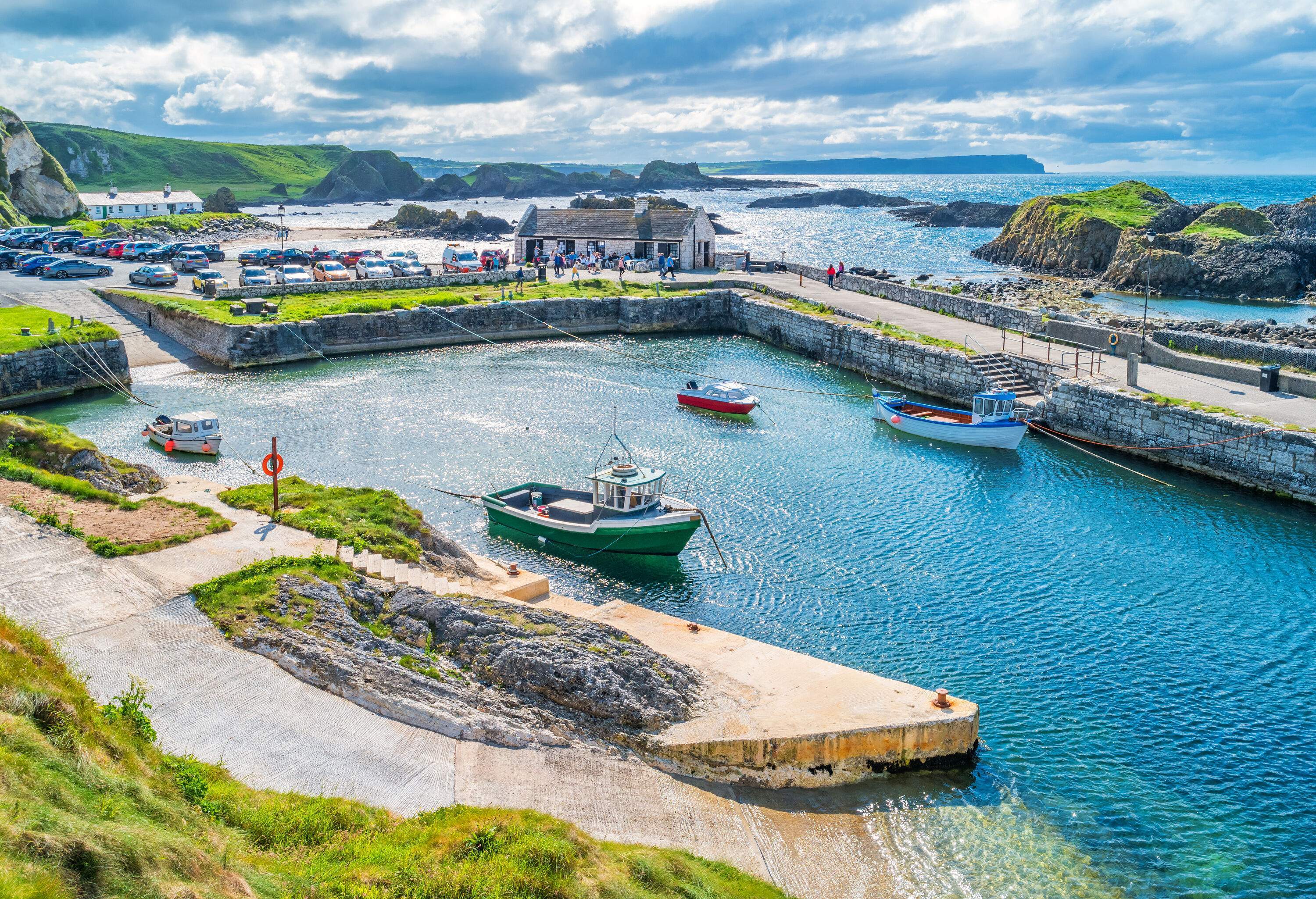 Stock photograph of the picturesque Ballintoy Harbour, Causeway Coast, Northern Ireland, UK on a sunny day.