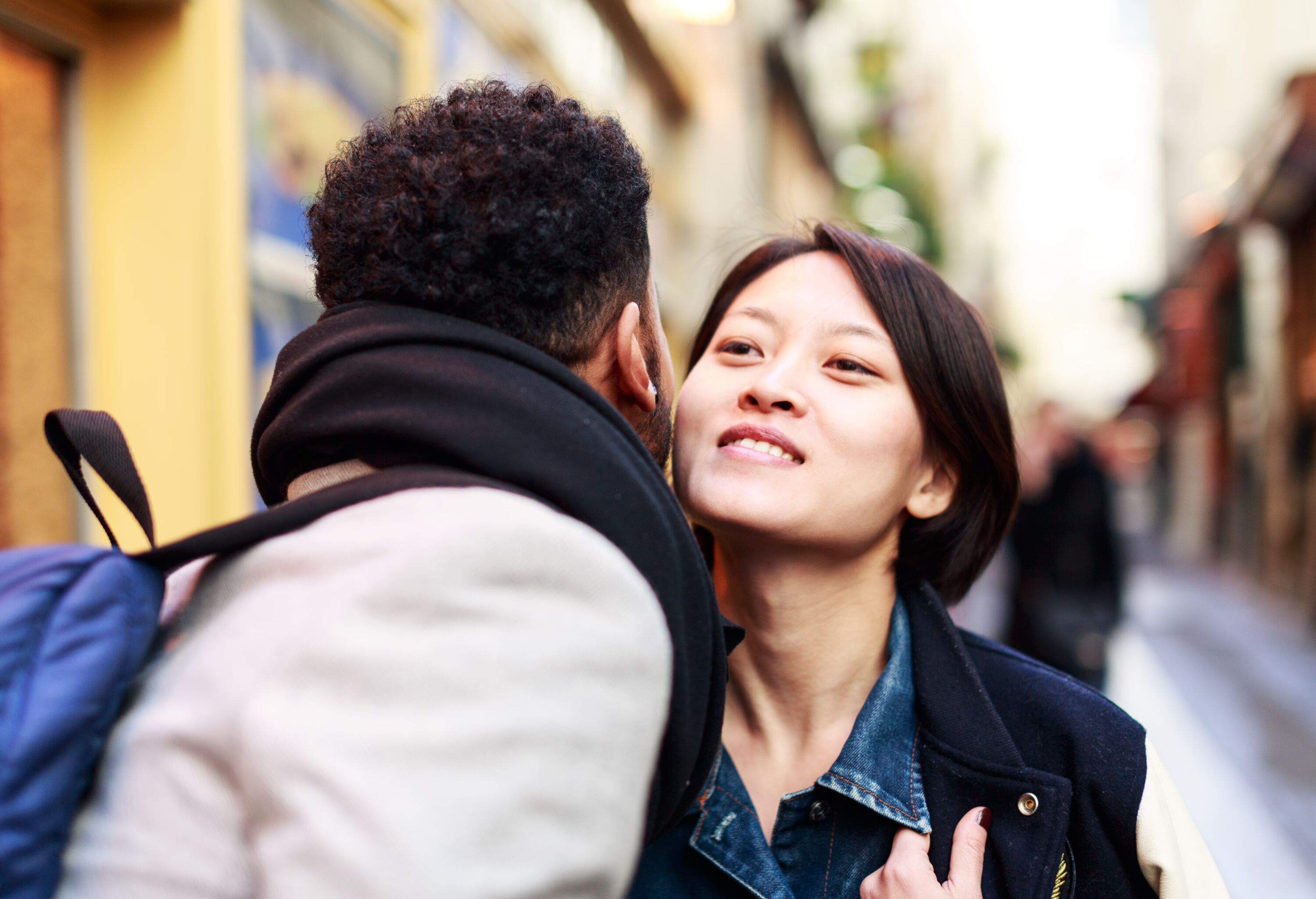 Young adults kissing in the streets of Paris