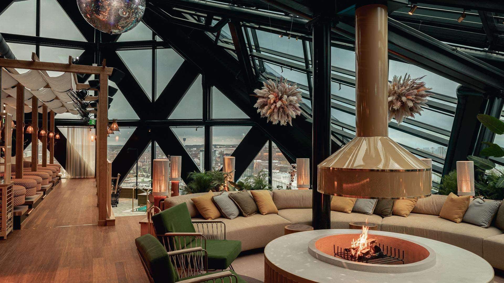 Modern hotel lounge with wintergarten and an open fire