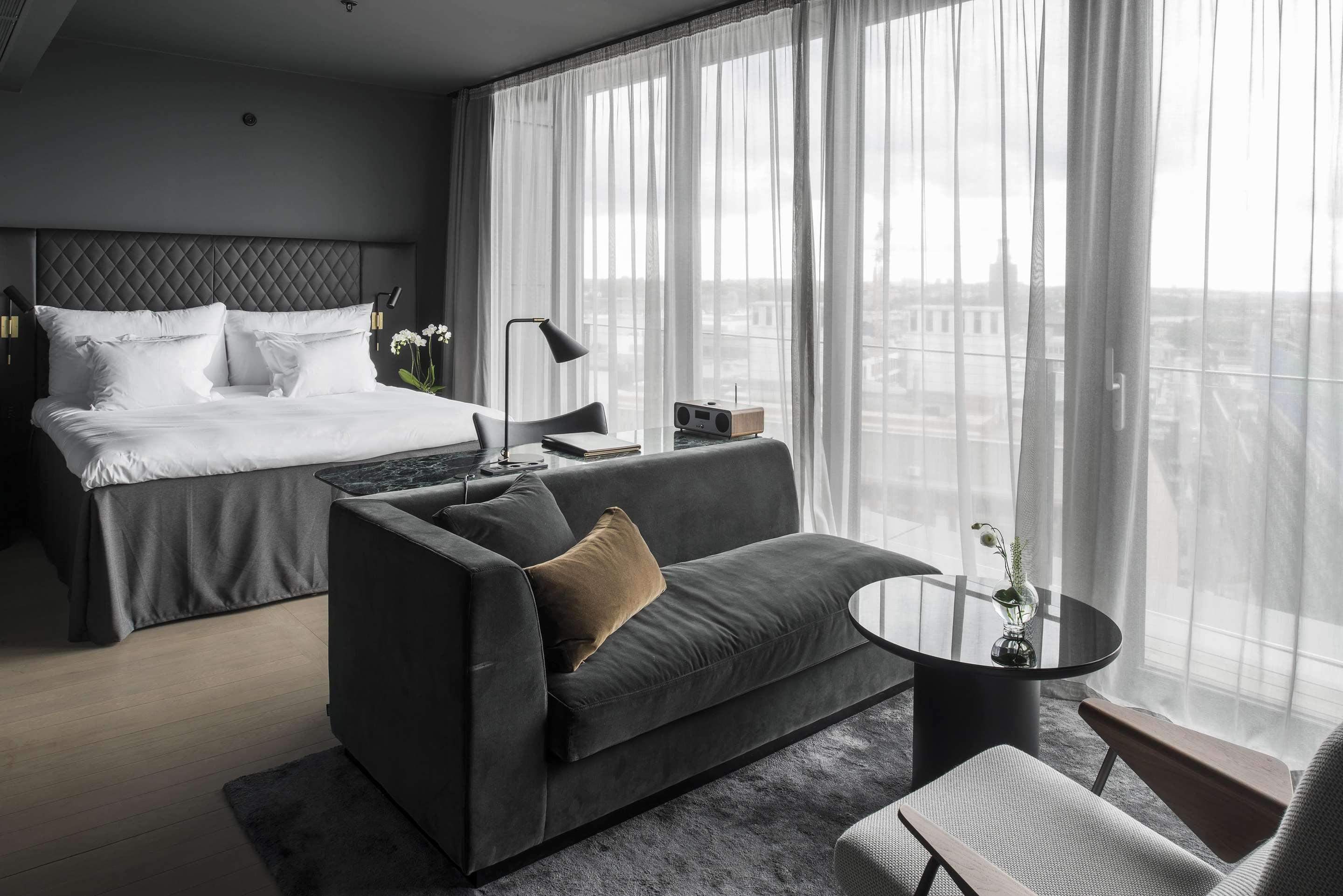 Modern interior hotel room in warm grey tones