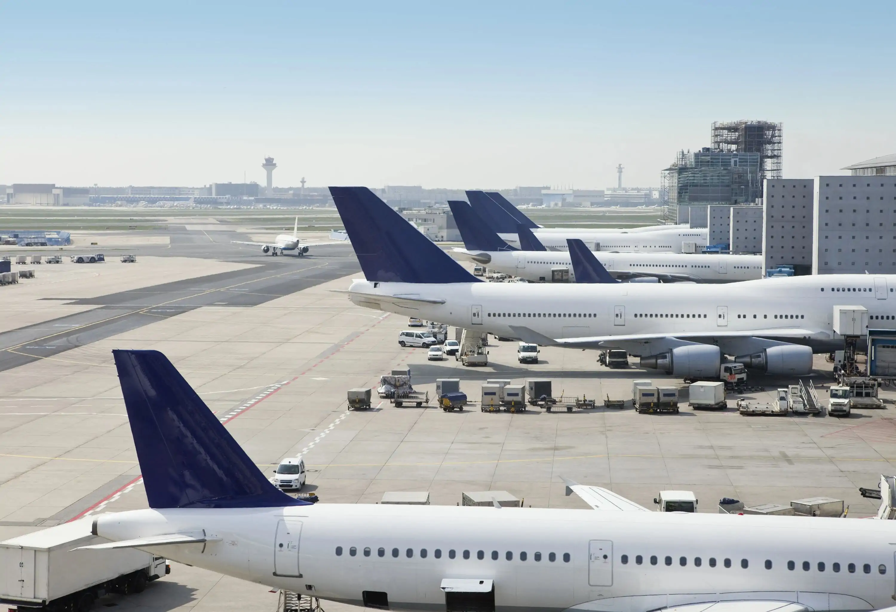 Filling cargo by side profile of an airplane on airport.