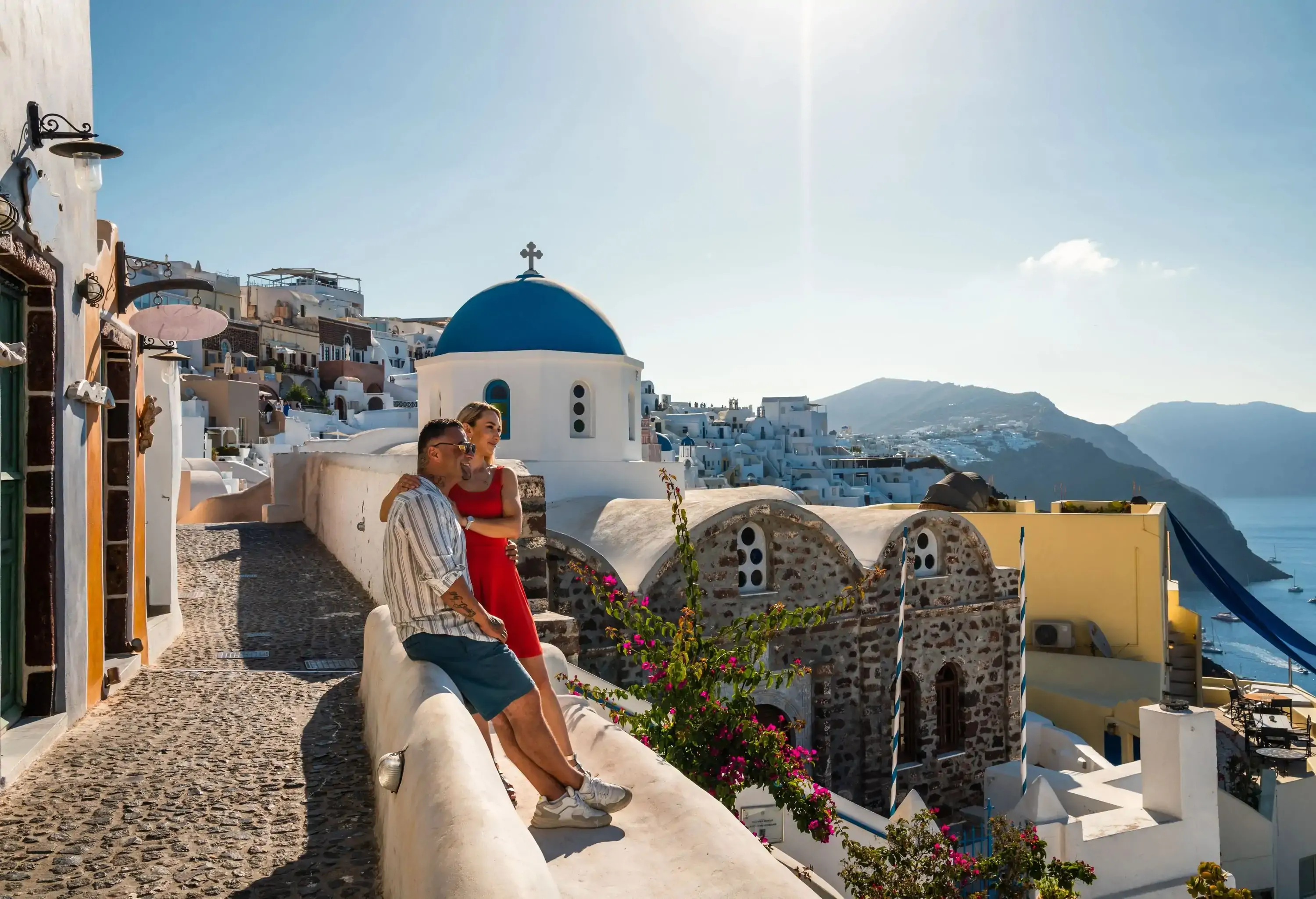 Happy romantic couple in Oia, Santorini, Cyclades islands, Greece