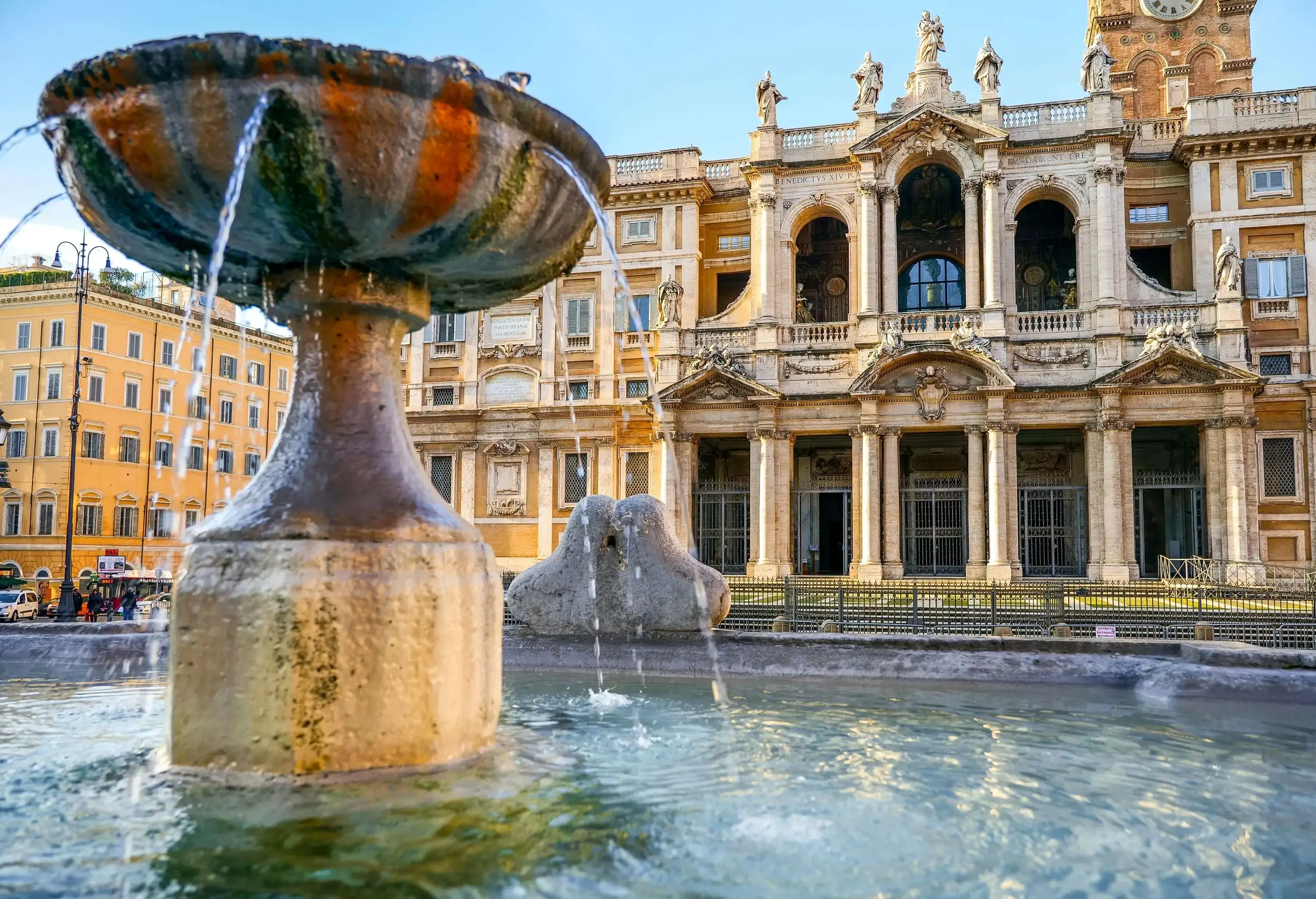 A fountain located in front of a church.